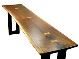 Custom hall table using a walnut slab top with inlaid hard maple butterfly accents and a custom flat black metal base. 