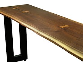 Custom hall table using a walnut slab top with inlaid hard maple butterfly accents and a custom flat black metal base. 