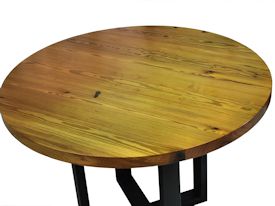 Custom bar table using a face grain reclaimed longleaf pine top and a custom flat black metal base. 
