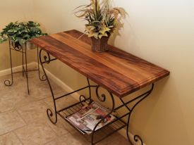 Custom hall table using a face grain iroko top and a flea-market metal base. 