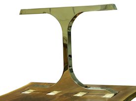 Custom dining table using walnut slabs with wane edges on a custom handmade mirror polished bronze base.
