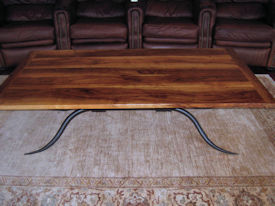 Custom coffee table using Texas Pecan with Bread Board Ends and a custom metal base. 