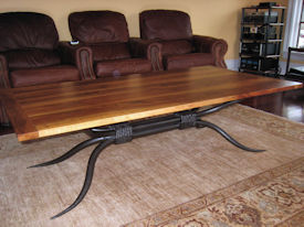 Custom coffee table using Texas Pecan with Bread Board Ends and a custom metal base. 