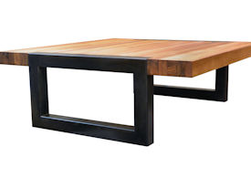 Custom edge grain teak coffee table with a flat black metal base. 