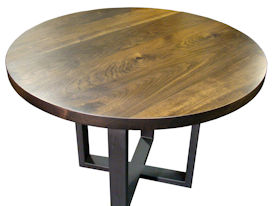 Custom bar table using a face grain walnut top and a custom flat black metal base. 