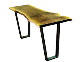 Custom Walnut Bookmatched Slab Table with Natural Edges, a Waterlox Finish and a flat black metal base. 