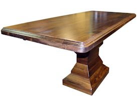 Custom distressed walnut table with pedestal-style base.