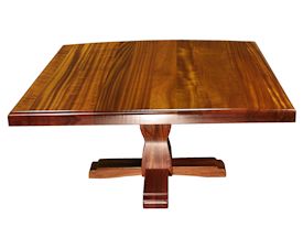 Custom jatoba table with pedestal-style base and drop-edge top.