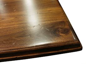 Custom distressed walnut table with pedestal-style base