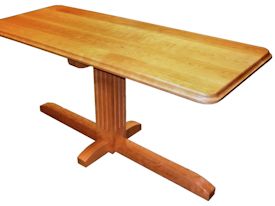 Custom cherry table with fluted pedestal-style base