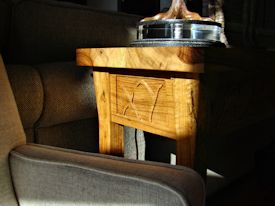 Custom Spalted Pecan sofa table with custom designed carved aprons and shaped shelf.