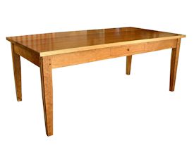 Custom Cherry shaker style dining table with drawer and walnut accents on legs.