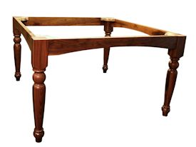Custom distressed Walnut dining table with custom designed turned legs and arched aprons.
