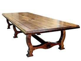 Custom distressed face grain Walnut trestle-style conference table with Wenge accents.  Pop-up electrical grommet access.  Through mortise and tenon jointery.