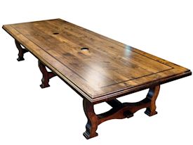 Custom distressed face grain Walnut trestle-style conference table with Wenge accents.  Pop-up electrical grommet access.  Through mortise and tenon jointery.