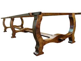 Custom distressed face grain Walnut trestle-style conference table with Wenge accents.  Pop-up electrical grommet access.  Through mortise and tenon jointery.