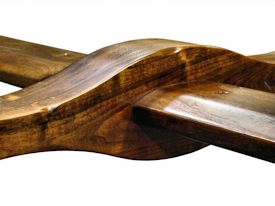 Custom distressed face grain Walnut trestle-style conference table with Wenge accents.  Pop-up electrical grommet access.  Through mortise and tenon jointery.