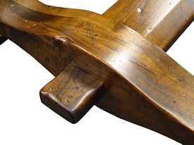 Custom distressed face grain Walnut trestle-style conference table with Wenge accents.  Pop-up electrical grommet access.  Through mortise and tenon jointery.