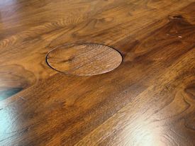 Custom distressed face grain Walnut trestle-style conference table with Wenge accents.  Pop-up electrical grommet access.  Through mortise and tenon jointery.