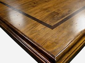 Custom distressed face grain Walnut trestle-style conference table with Wenge accents.  Pop-up electrical grommet access.  Through mortise and tenon jointery.