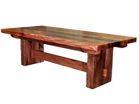 Custom face grain argentinean mesquite dining table.  Rustic trestle-style construction with through mortise and tenon jointery and hand carved edges.