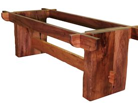 Custom face grain argentinean mesquite dining table.  Rustic trestle-style construction with through mortise and tenon jointery and hand carved edges.