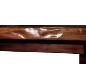 Custom face grain argentinean mesquite dining table.  Rustic trestle-style construction with through mortise and tenon jointery and hand carved edges.