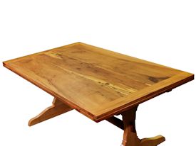 Custom trestle style dining table with self-storing leaves.  Made from spalted pecan with bread board ends and mortise and tenon jointery.