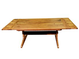 Custom trestle style dining table with self-storing leaves.  Made from spalted pecan with bread board ends and mortise and tenon jointery.