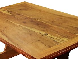 Custom trestle style dining table with self-storing leaves.  Made from spalted pecan with bread board ends and mortise and tenon jointery.
