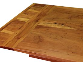 Custom trestle style dining table with self-storing leaves.  Made from spalted pecan with bread board ends and mortise and tenon jointery.