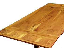Custom trestle style dining table with self-storing leaves.  Made from spalted pecan with bread board ends and mortise and tenon jointery.