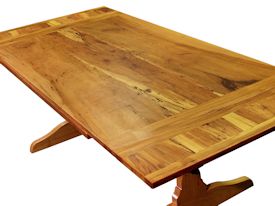 Custom trestle style dining table with self-storing leaves.  Made from spalted pecan with bread board ends and mortise and tenon jointery.