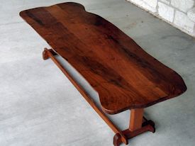 Custom mesquite coffee table with mahogany trestle style base.