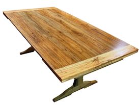 Custom spalted pecan trestle-style table with self storing leaves.  Face grain construction with bread board ends.