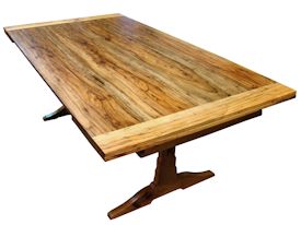 Custom spalted pecan trestle-style table with self storing leaves.  Face grain construction with bread board ends.