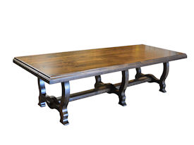 Distressed face grain Walnut trestle-style dining table with mortise and tenon jointery.