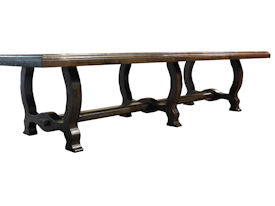 Distressed face grain Walnut trestle-style dining table with mortise and tenon jointery.