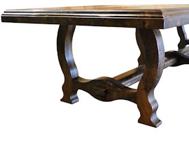 Distressed face grain Walnut trestle-style dining table with mortise and tenon jointery.