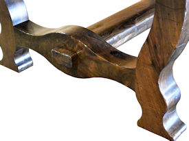 Distressed face grain Walnut trestle-style dining table with mortise and tenon jointery.